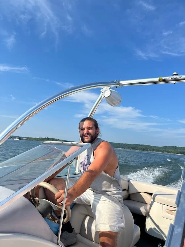 Dustin from The Dam Boathouse boating on Lake Monroe